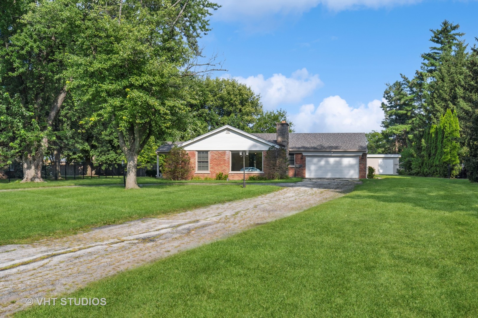 2425 Pfingsten Road Glenview, IL 60026 - Photo 2 of 22 a front view of a house with a yard and trees