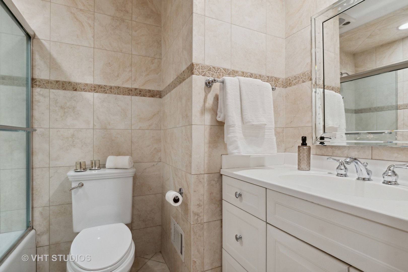 2425 Pfingsten Road Glenview, IL 60026 - Photo 9 of 22 a bathroom with a sink a toilet and shower