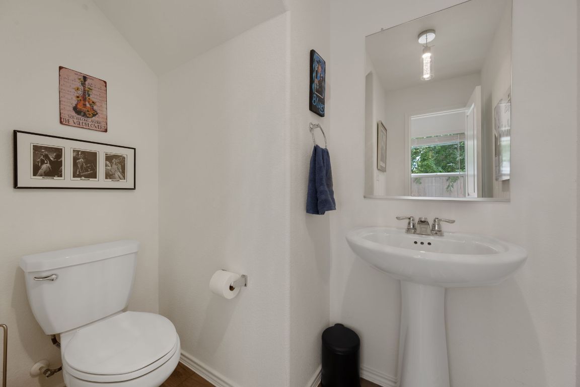 68 Trinity Circle Lockhart, TX 78644 - Photo 13 of 27 a bathroom with a toilet sink and mirror