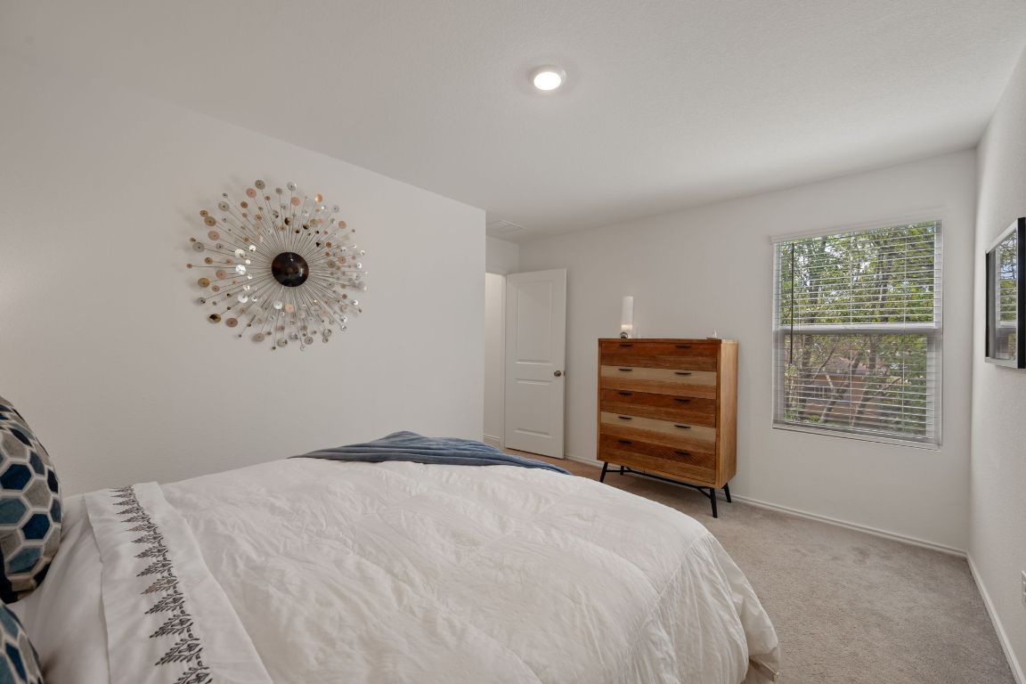 68 Trinity Circle Lockhart, TX 78644 - Photo 16 of 27 a bedroom with a bed and a window