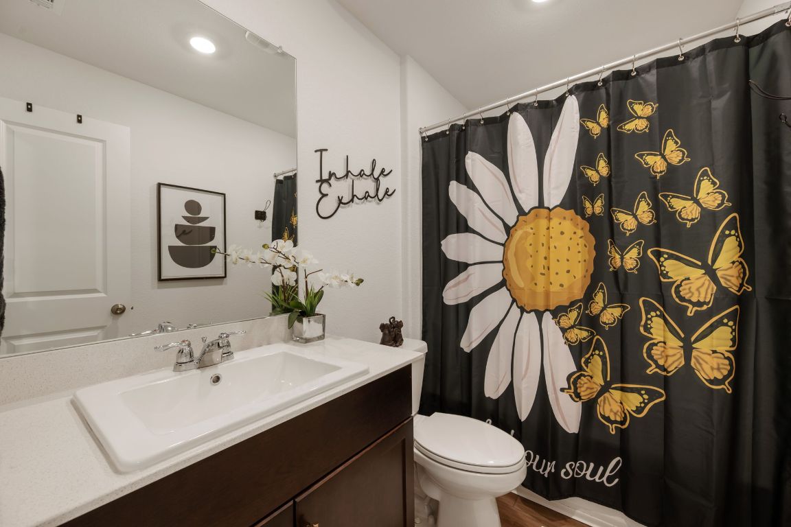 68 Trinity Circle Lockhart, TX 78644 - Photo 19 of 27 a bathroom with a sink and a mirror