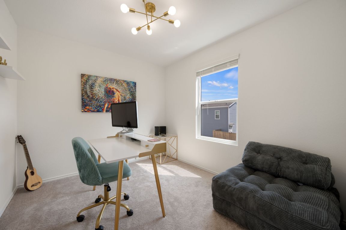 68 Trinity Circle Lockhart, TX 78644 - Photo 20 of 27 a living room with furniture and a flat screen tv