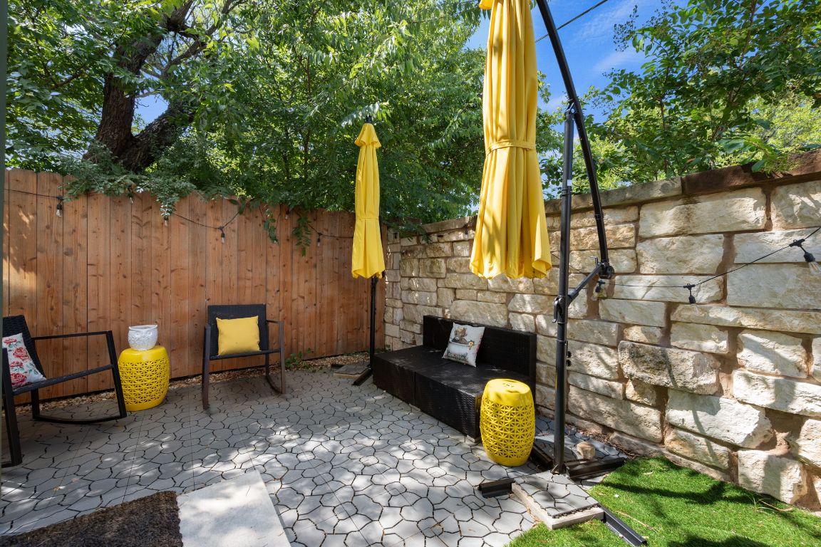 68 Trinity Circle Lockhart, TX 78644 - Photo 22 of 27 a backyard of a house with table and chairs