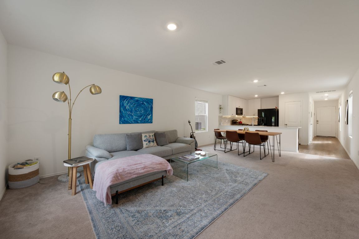 68 Trinity Circle Lockhart, TX 78644 - Photo 3 of 27 a living room with furniture and a couch