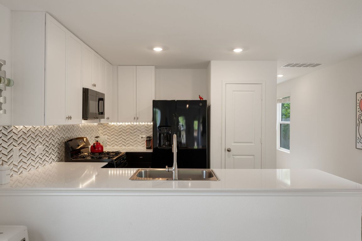 68 Trinity Circle Lockhart, TX 78644 - Photo 9 of 27 a bathroom with a bathtub and a shower