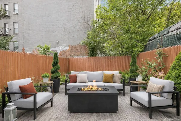 a outdoor sitting area with furniture and a couch