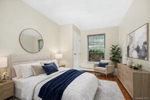 a bedroom with bed and a window