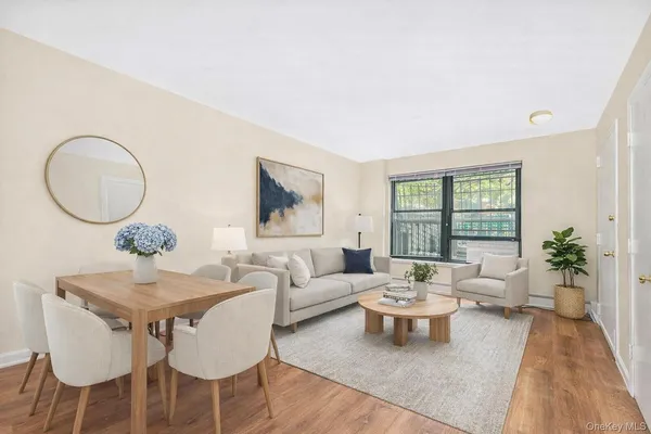 a living room with furniture a table and a large mirror