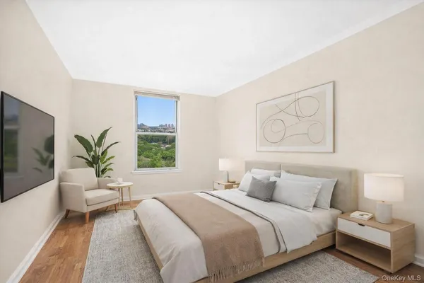 a bedroom with a large bed and a couch