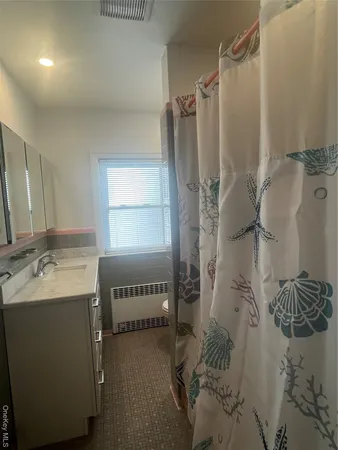 a bathroom with a sink and mirror