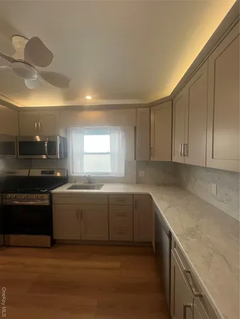 a view of a kitchen with a sink