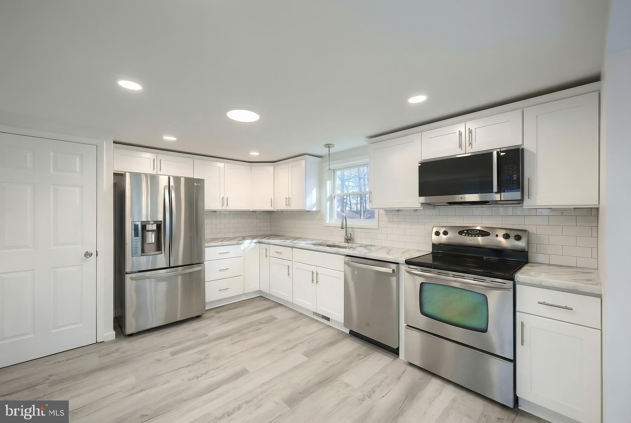 287 Chestnut Hill Road York, PA 17402 - Photo 11 of 36 a kitchen with stainless steel appliances granite countertop a refrigerator stove and sink
