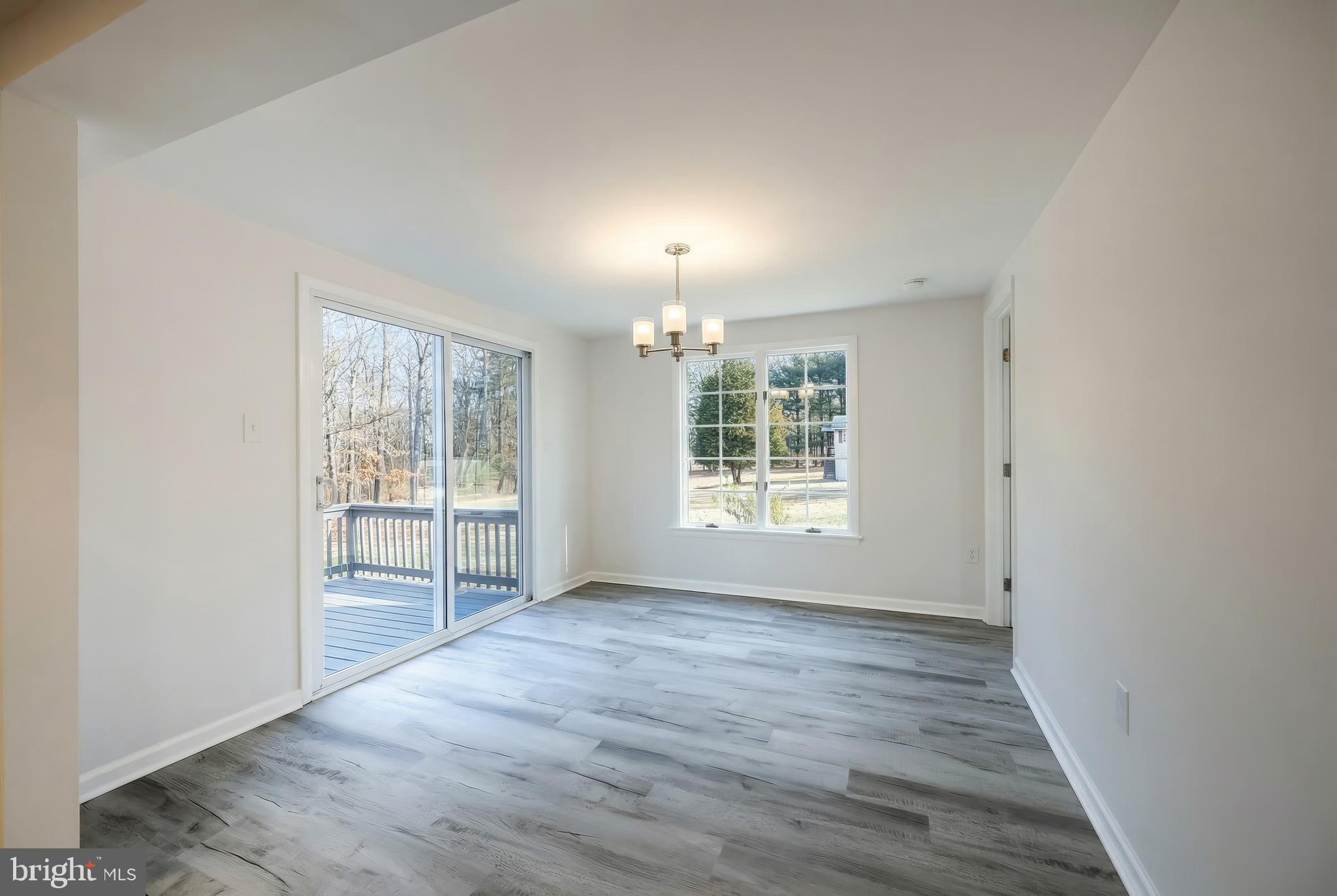 287 Chestnut Hill Road York, PA 17402 - Photo 12 of 36 an empty room with wooden floor and windows