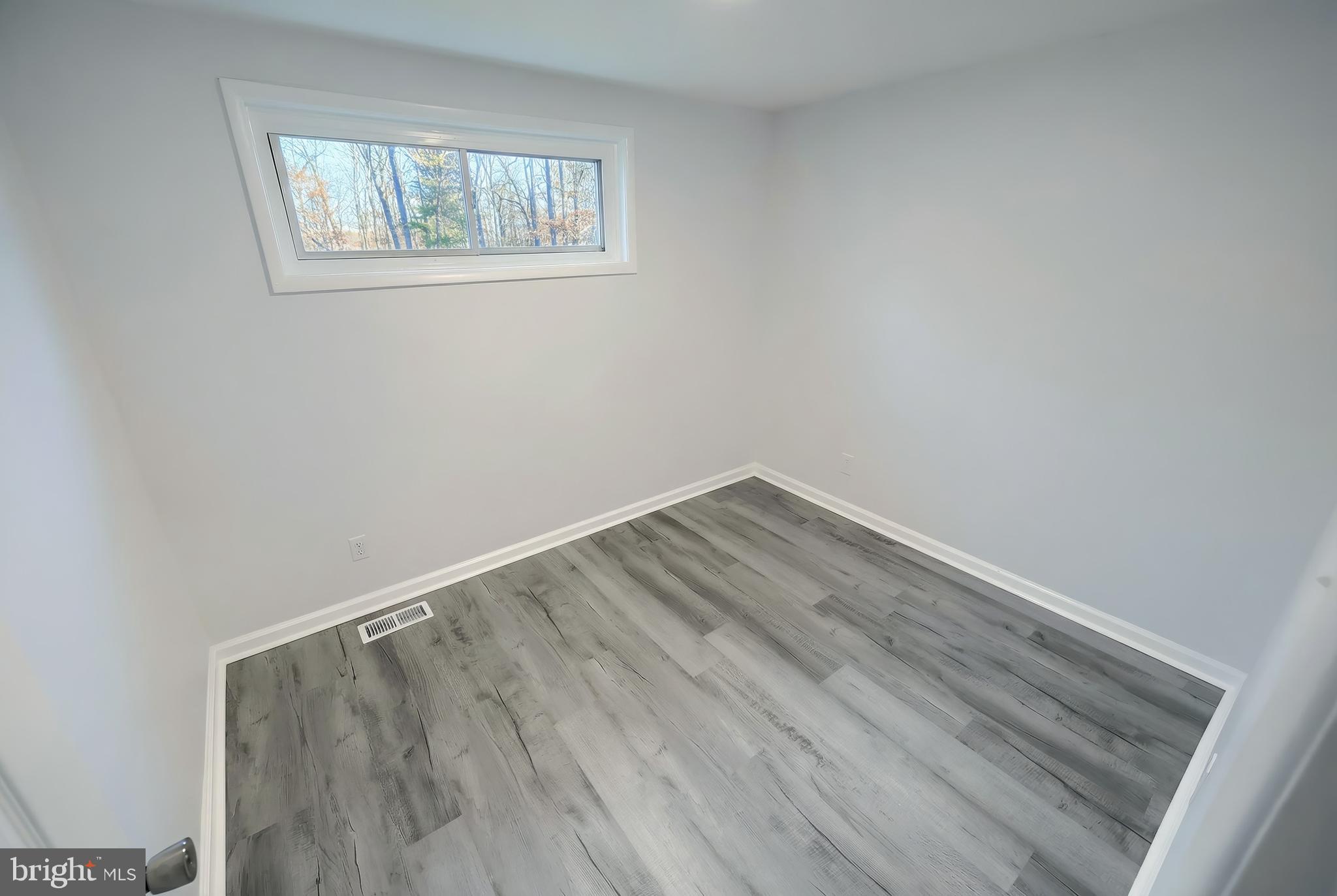 287 Chestnut Hill Road York, PA 17402 - Photo 17 of 36 a view of wooden floor in an empty room