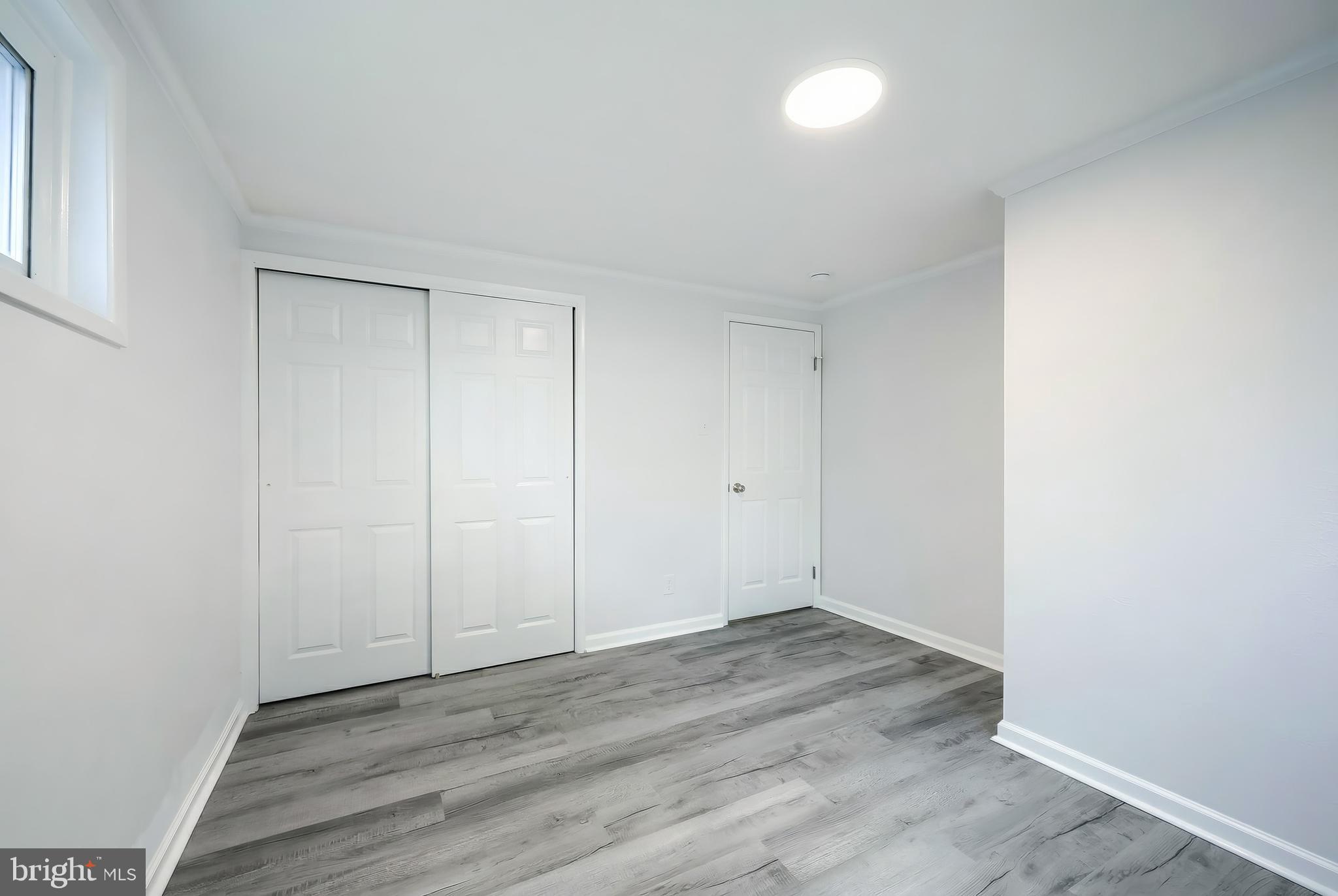 287 Chestnut Hill Road York, PA 17402 - Photo 21 of 36 an empty room with wooden floor and windows