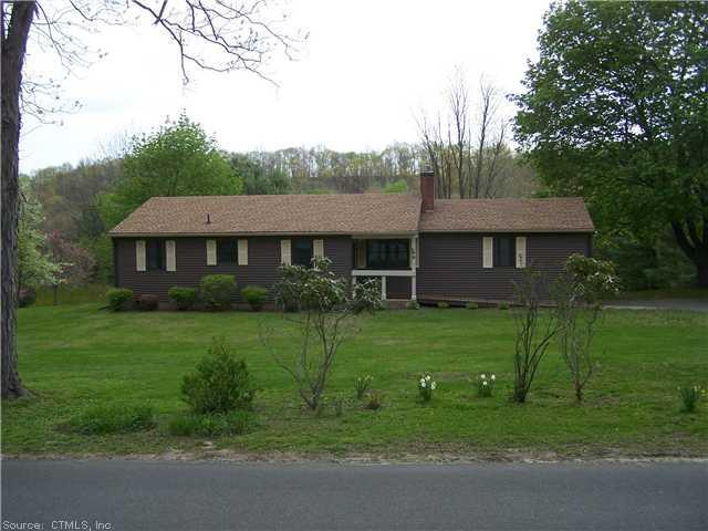 80 West Morris Road Morris, CT 06763 - Photo 1 of 1 a front view of a house with a yard