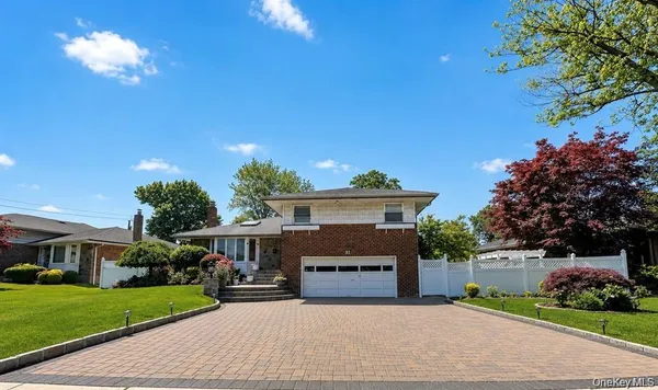 a view of house with yard outdoor seating and green space