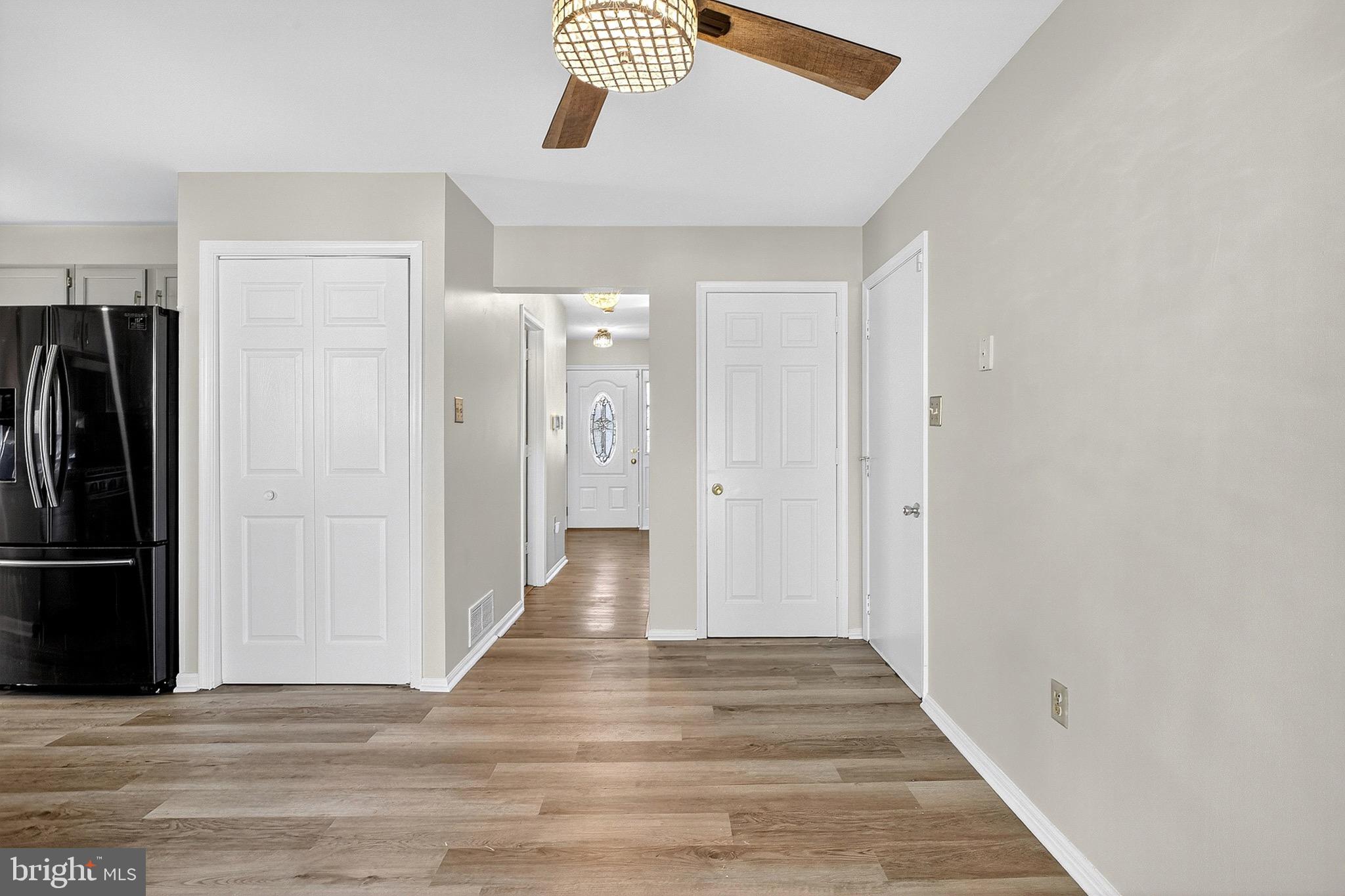 221 Romeo Drive New Castle, DE 19720 - Photo 23 of 38 a view of a hallway with wooden floor