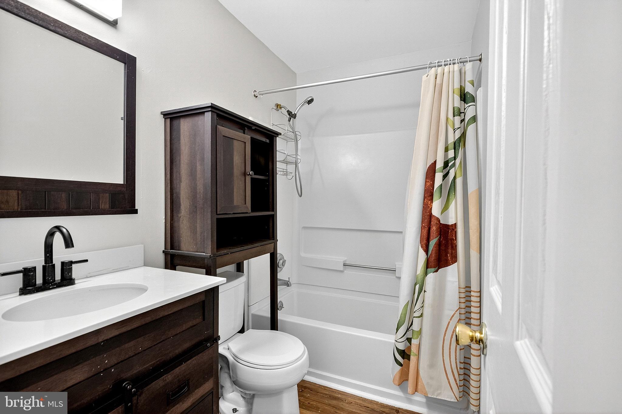221 Romeo Drive New Castle, DE 19720 - Photo 25 of 38 a bathroom with a sink toilet and shower