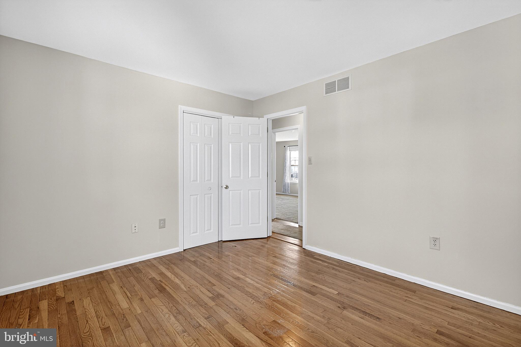 221 Romeo Drive New Castle, DE 19720 - Photo 28 of 38 a view of an empty room with wooden floor