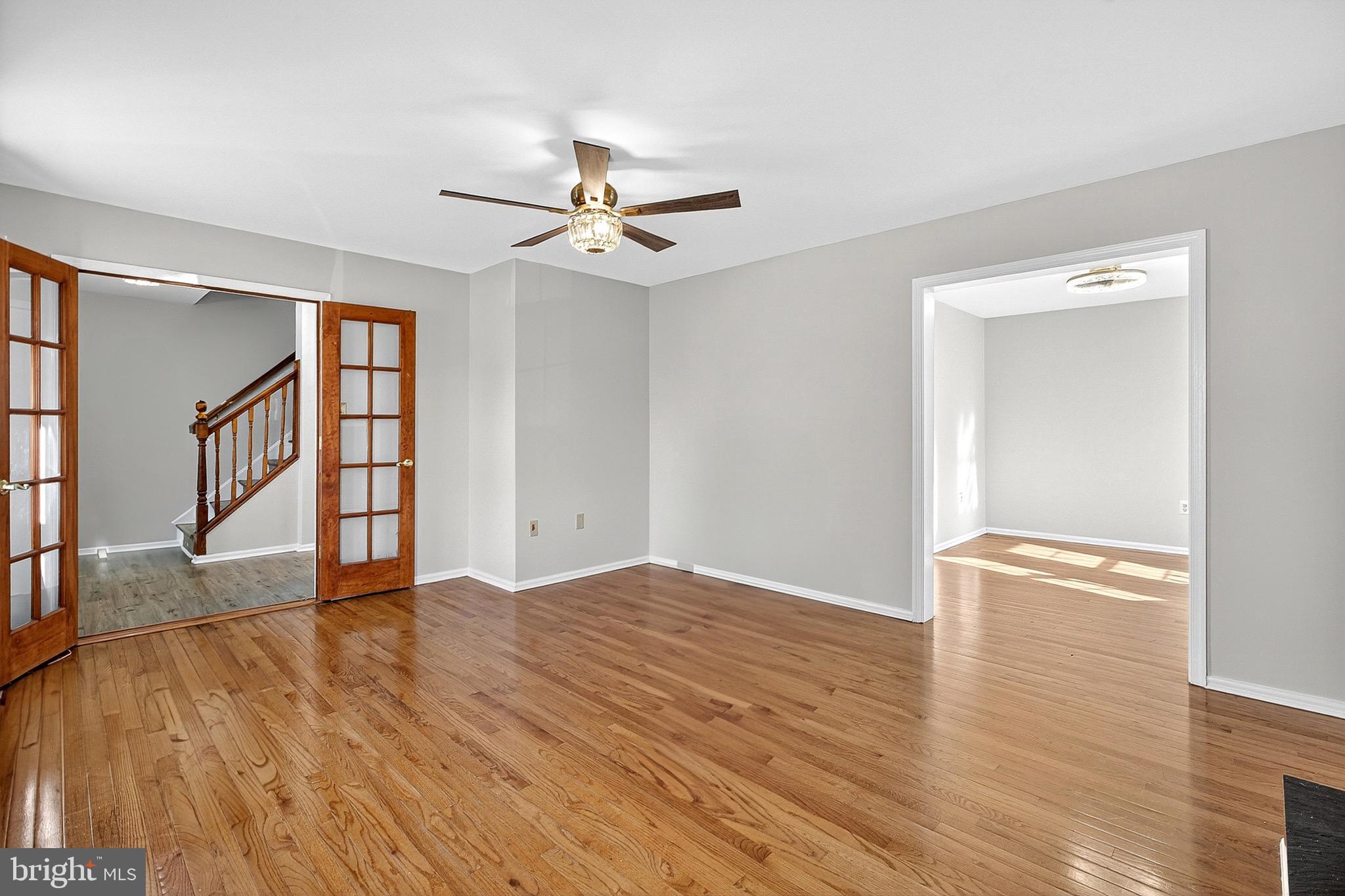 221 Romeo Drive New Castle, DE 19720 - Photo 10 of 38 a view of an empty room with a window and wooden floor
