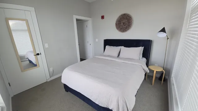 a bathroom with a sink toilet and mirror