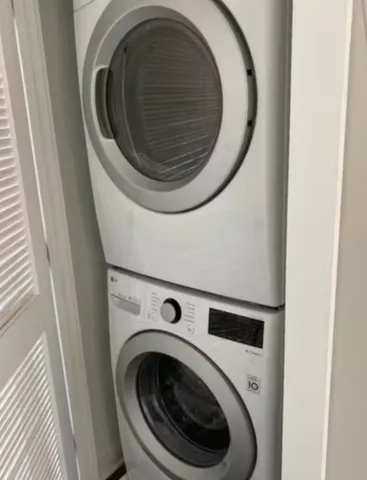 a view of a building with a yard in front of it