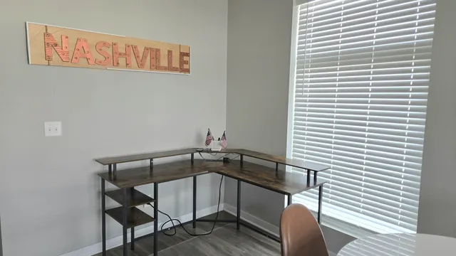 a view of a hall way with furniture