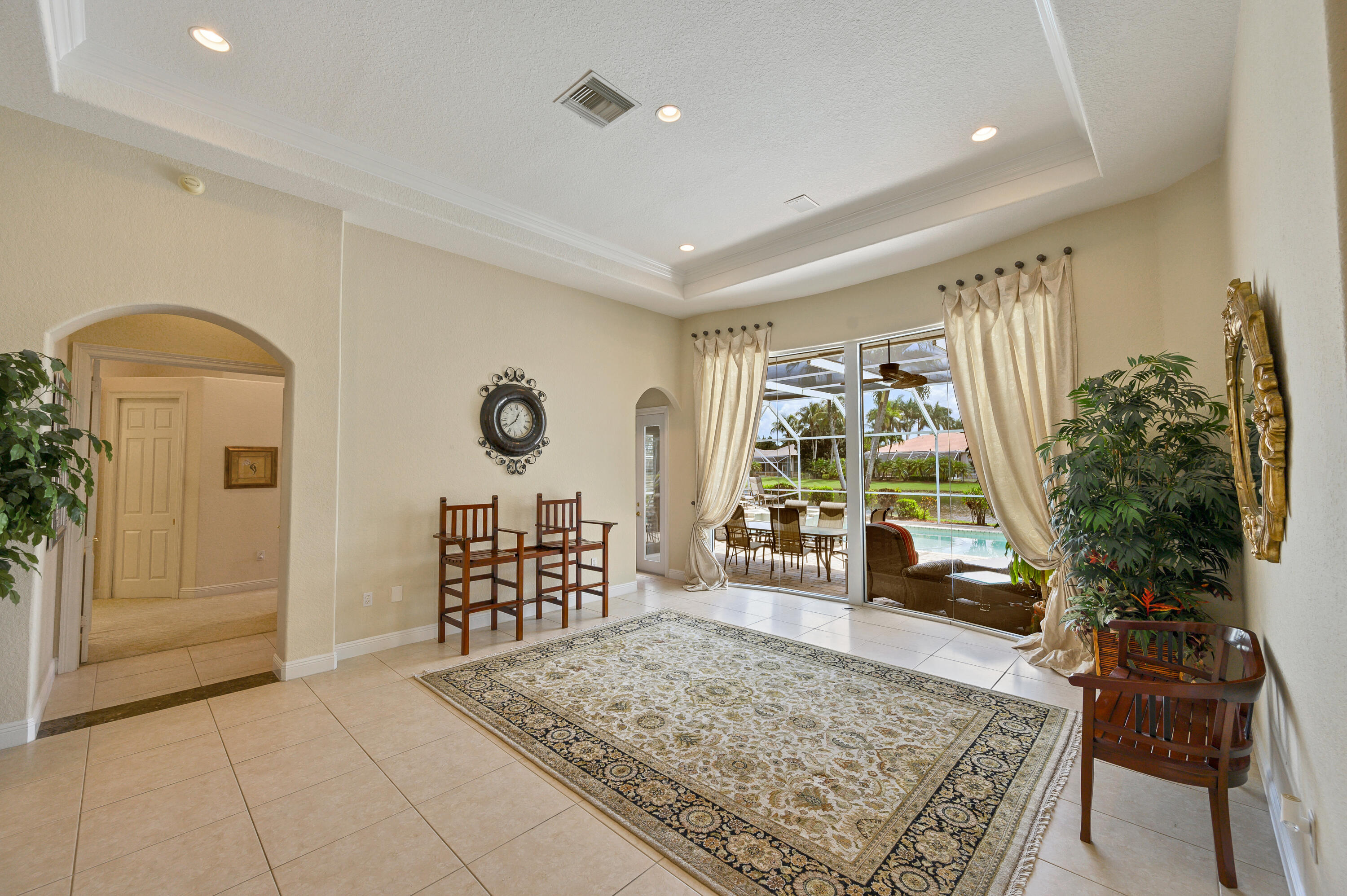 11840 Bayfield Drive Boca Raton, FL 33498 - Photo 11 of 28 a living room with furniture and a large window