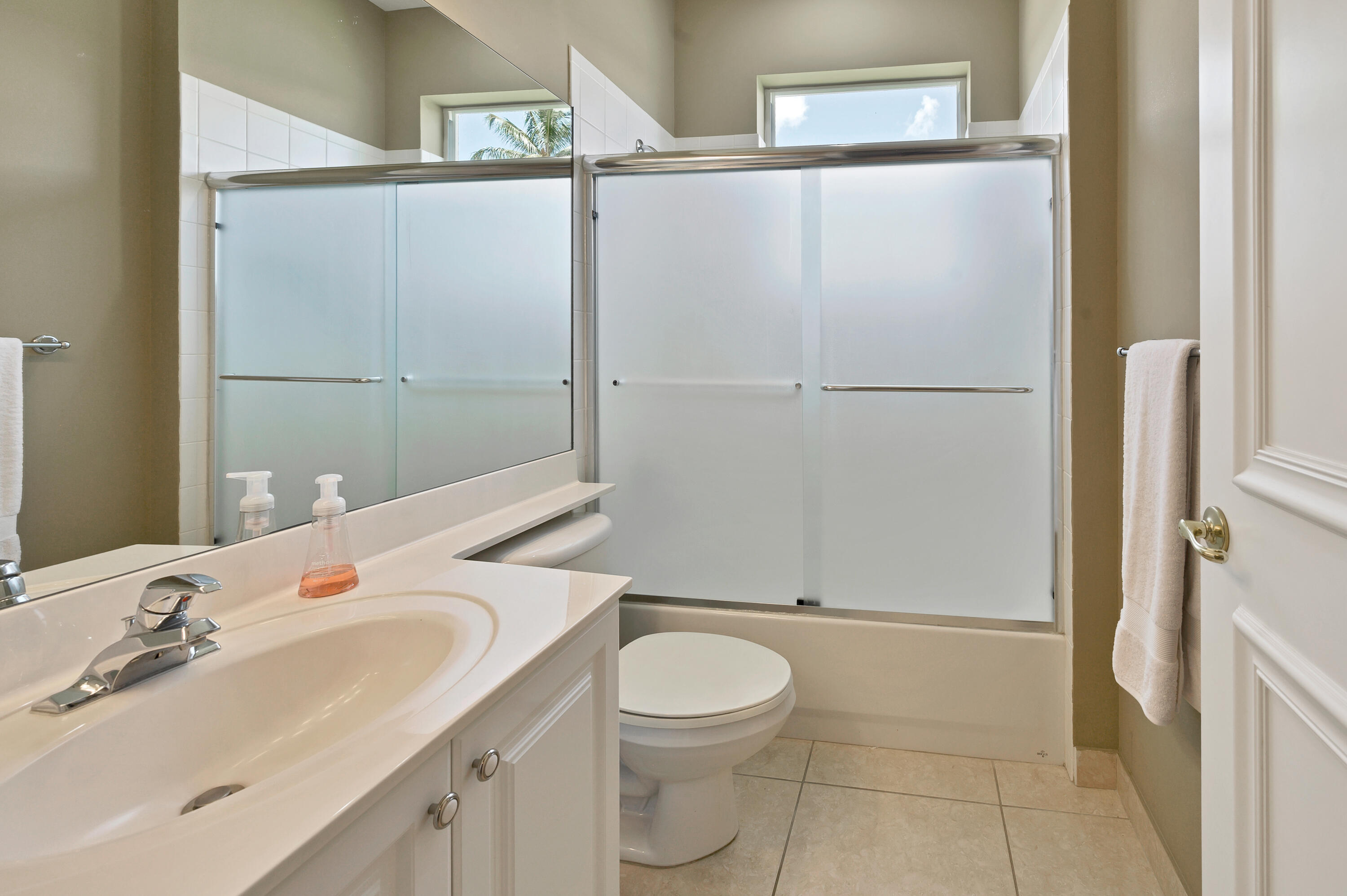 11840 Bayfield Drive Boca Raton, FL 33498 - Photo 16 of 28 a bathroom with a sink toilet and shower