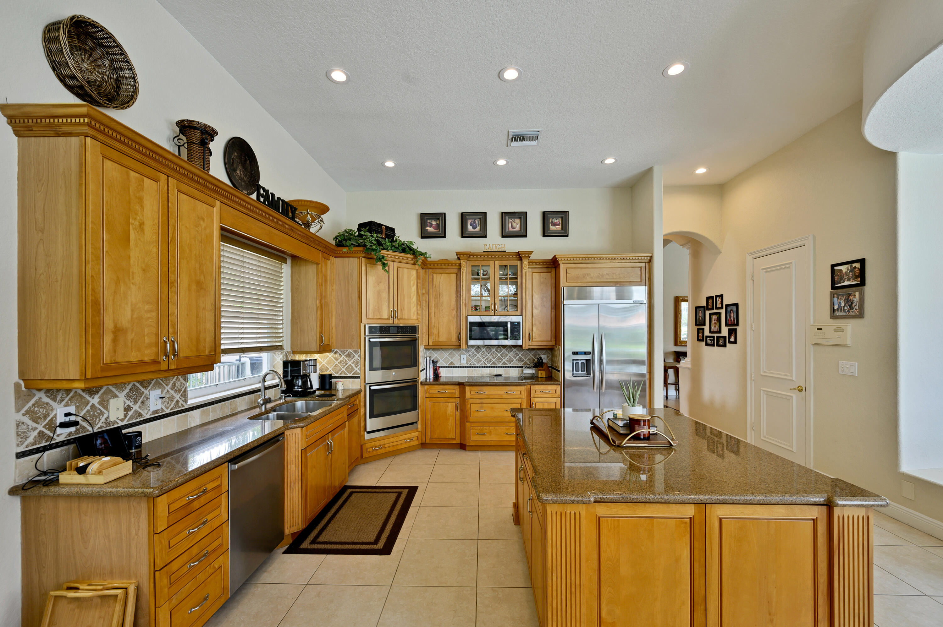 11840 Bayfield Drive Boca Raton, FL 33498 - Photo 7 of 28 a very nice looking kitchen with a large counter space