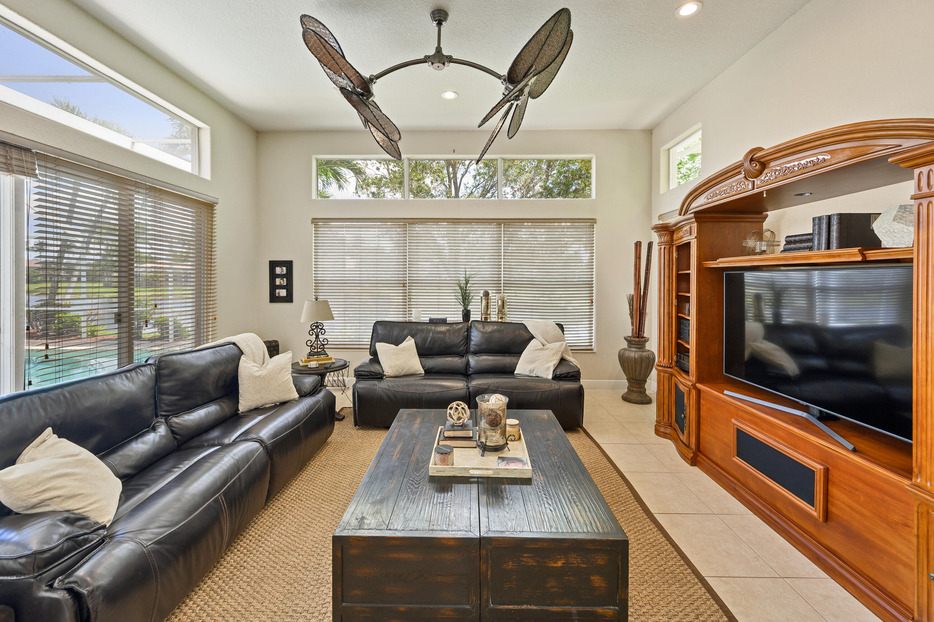 11840 Bayfield Drive Boca Raton, FL 33498 - Photo 8 of 28 a living room with furniture and a flat screen tv