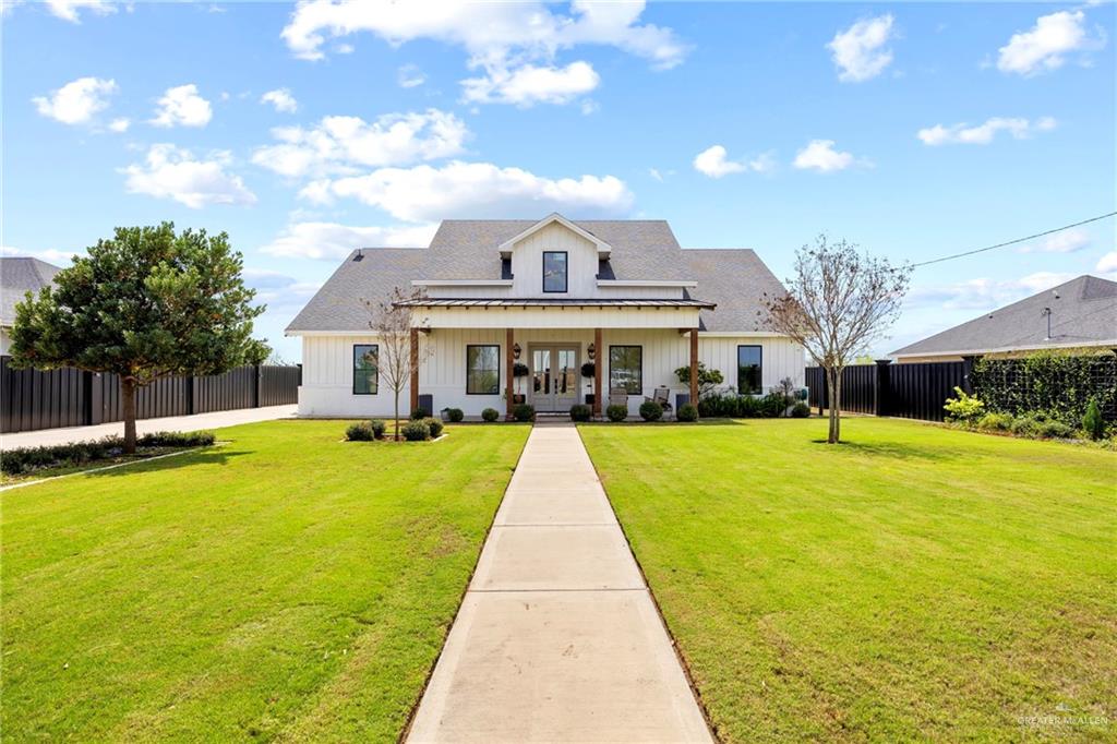 a view of house with swimming pool and view of an outdoor space