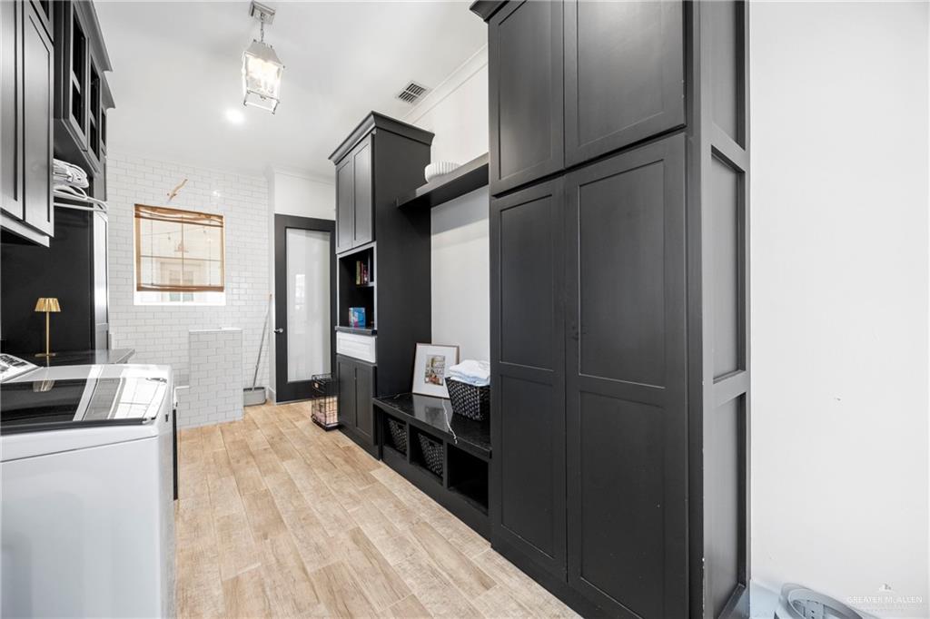 2860 North Fm 2360 Rio Grande City, TX 78582 - Photo 16 of 32 a kitchen with stainless steel appliances kitchen island granite countertop a refrigerator and a stove top oven