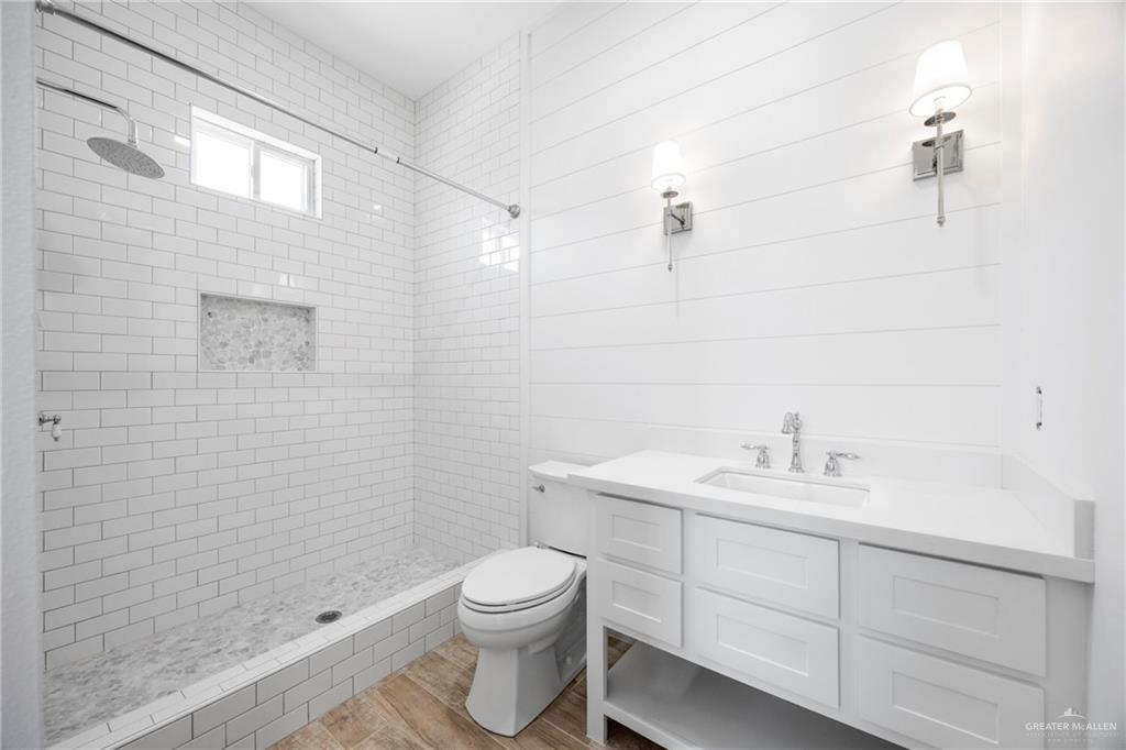 2860 North Fm 2360 Rio Grande City, TX 78582 - Photo 18 of 32 a bathroom with a toilet sink vanity shower and mirror
