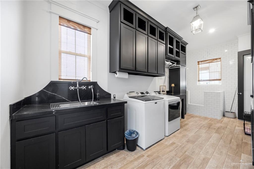 2860 North Fm 2360 Rio Grande City, TX 78582 - Photo 20 of 32 a kitchen with a sink a stove and cabinets
