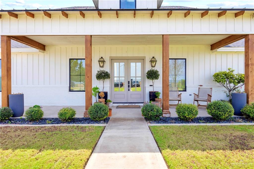 2860 North Fm 2360 Rio Grande City, TX 78582 - Photo 2 of 32 a front view of a house having yard