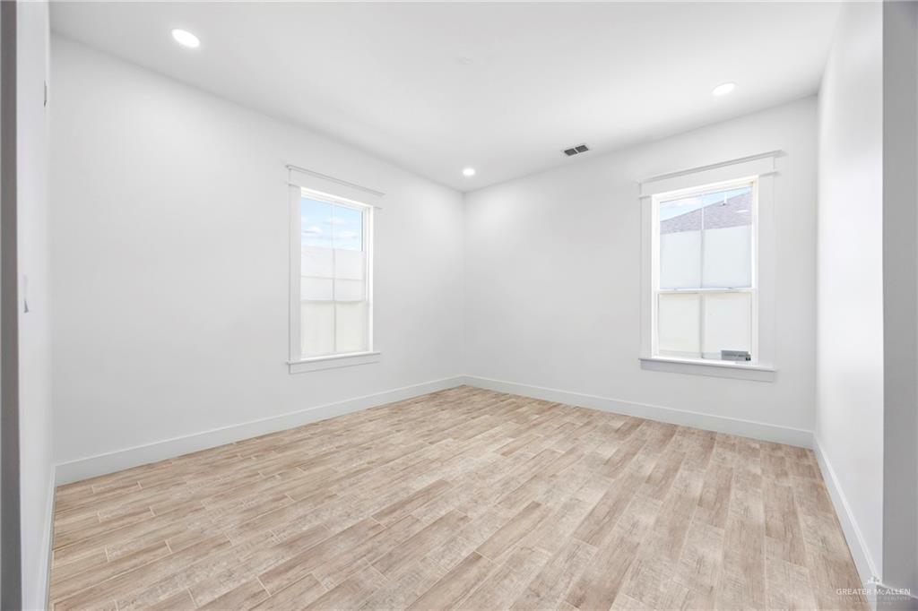 2860 North Fm 2360 Rio Grande City, TX 78582 - Photo 21 of 32 wooden floor in an empty room with a window
