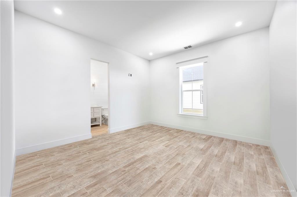 2860 North Fm 2360 Rio Grande City, TX 78582 - Photo 22 of 32 a view of empty room with wooden floor and fan