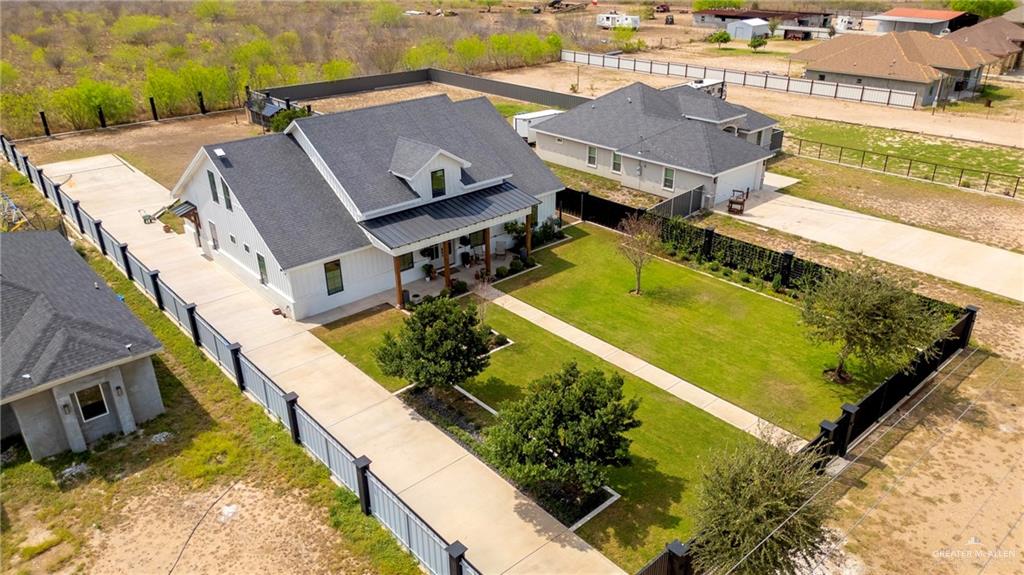 2860 North Fm 2360 Rio Grande City, TX 78582 - Photo 27 of 32 an aerial view of a house with a garden and swimming pool