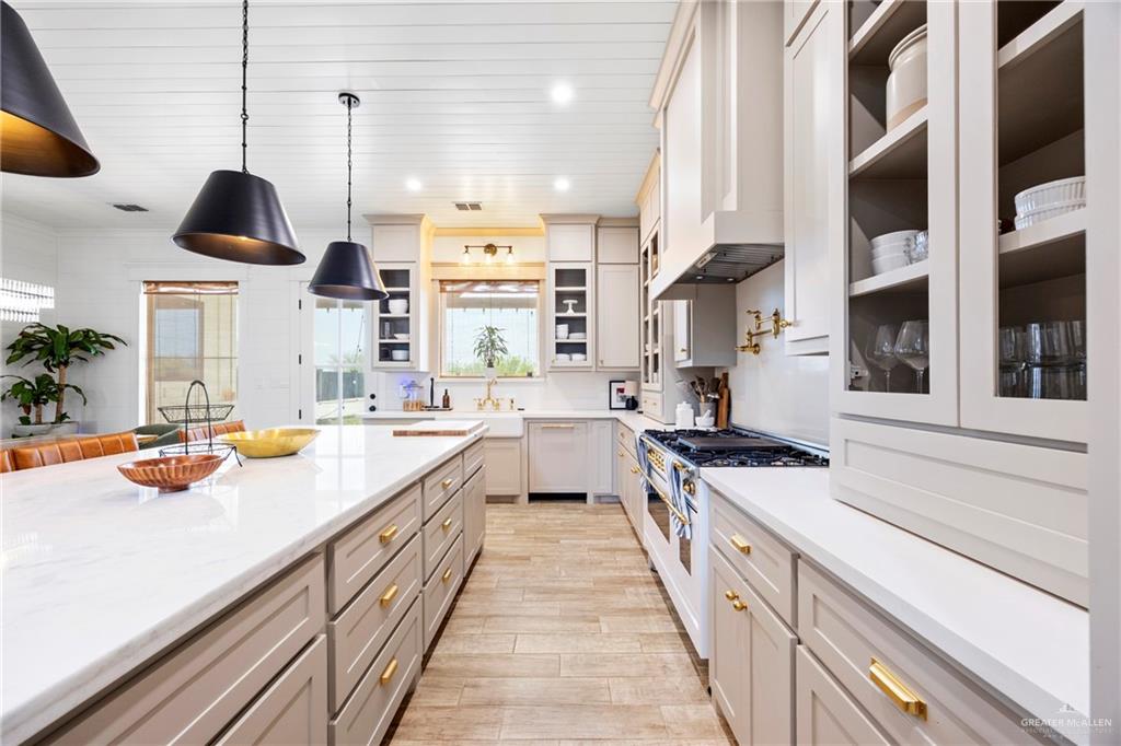 2860 North Fm 2360 Rio Grande City, TX 78582 - Photo 4 of 32 a kitchen with stainless steel appliances a stove a sink and a wooden floors