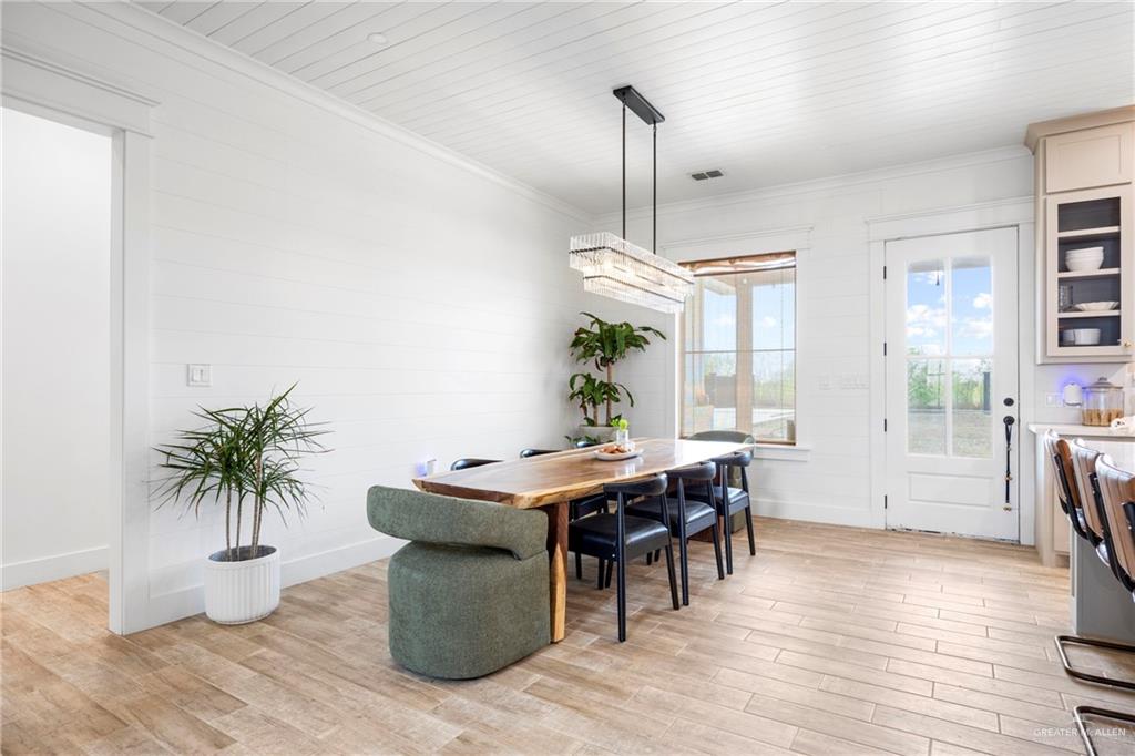 2860 North Fm 2360 Rio Grande City, TX 78582 - Photo 7 of 32 a view of a dining room with furniture window and wooden floor