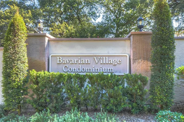 a view of a yard with large trees