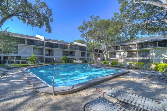 a view of a house with backyard backyard and sitting area