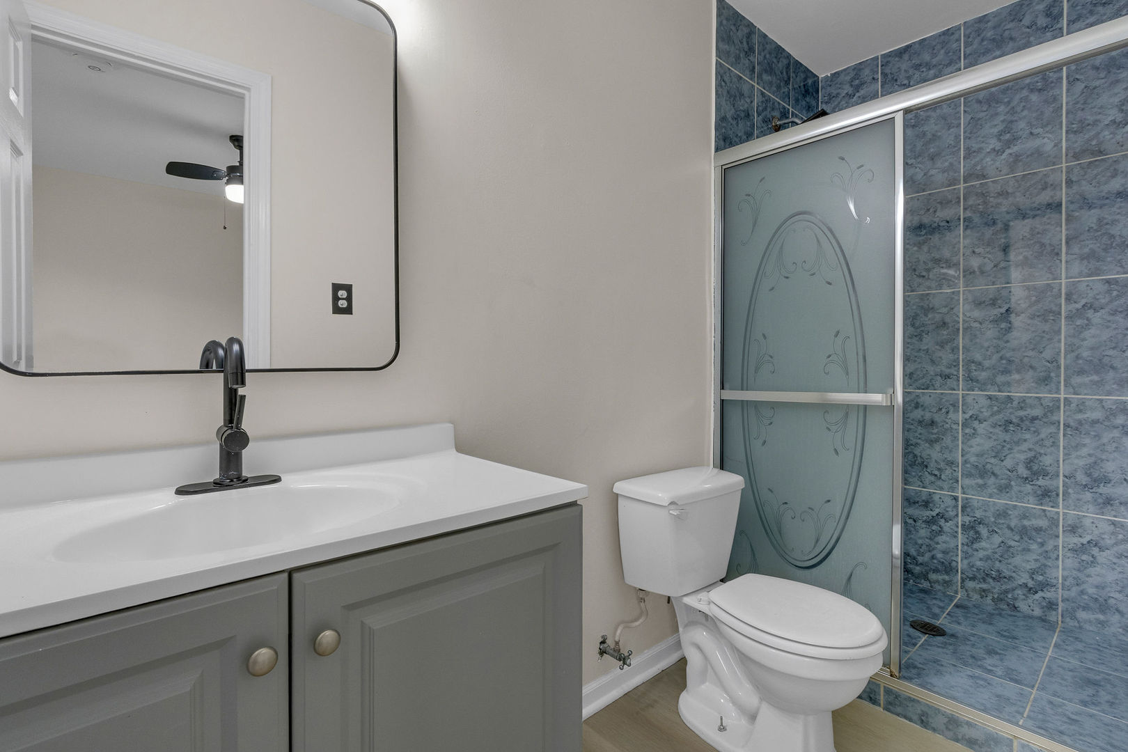 1190 Ash Road Hoffman Estates, IL 60169 - Photo 13 of 27 a bathroom with a sink a toilet and shower