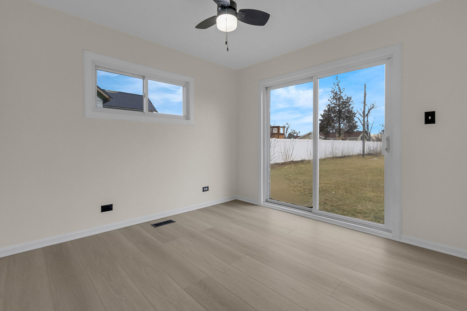 1190 Ash Road Hoffman Estates, IL 60169 - Photo 16 of 27 an empty room with fan and windows