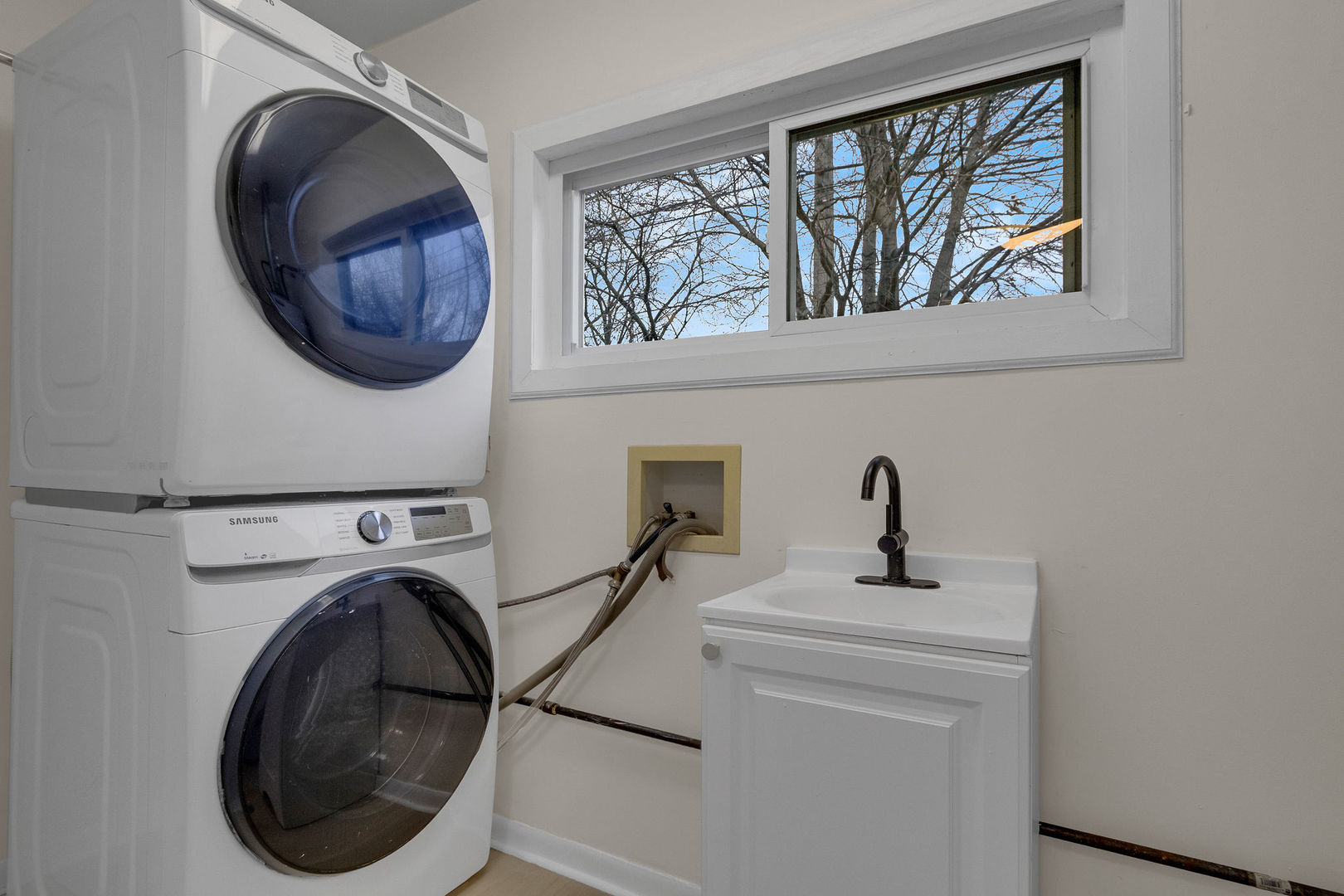 1190 Ash Road Hoffman Estates, IL 60169 - Photo 19 of 27 a view of a hallway with washer and dryer