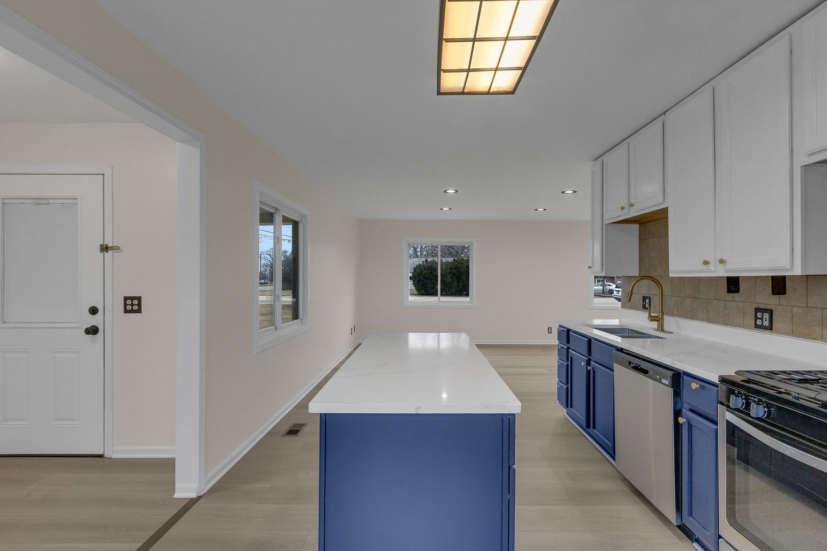 1190 Ash Road Hoffman Estates, IL 60169 - Photo 6 of 27 a kitchen with stainless steel appliances granite countertop a sink and a stove top oven
