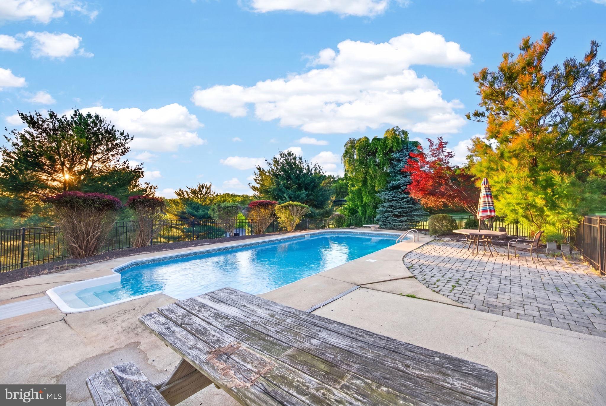 8840 Mapleville Road Mount Airy, MD 21771 - Photo 81 of 106 pool deck with extensive hardscape and landscape