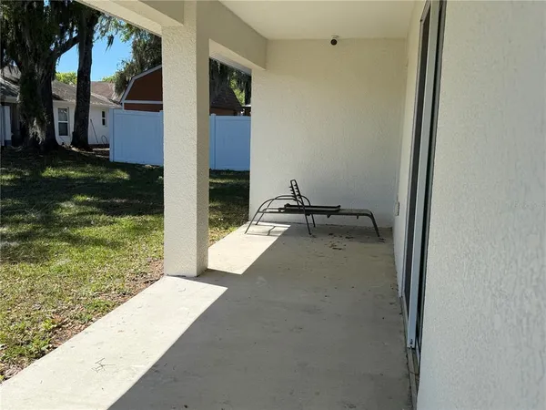a view of balcony with two chairs and a table